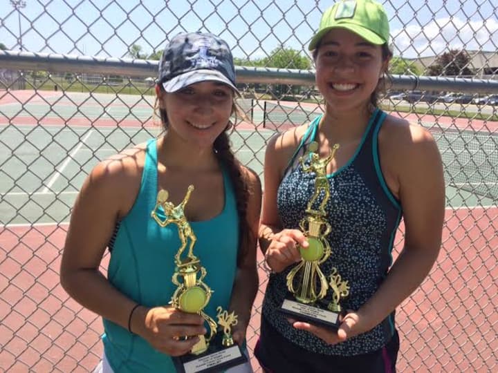 Players show their trophies after competing in a USTA tournament at Norwalk High School. Slammer Tennis World hosted the tournament.