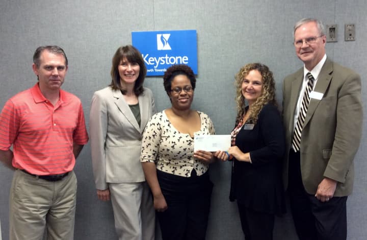From left, Keystone House&#x27;s Barry McGovern, Valerie S. Williams and Marsha Placide with the $5,000 grant given by First County Bank&#x27;s Elona Needle and David Van Buskirk toward the Norwalk organization&#x27;s &quot;Home Sweet Home&quot; initiative.