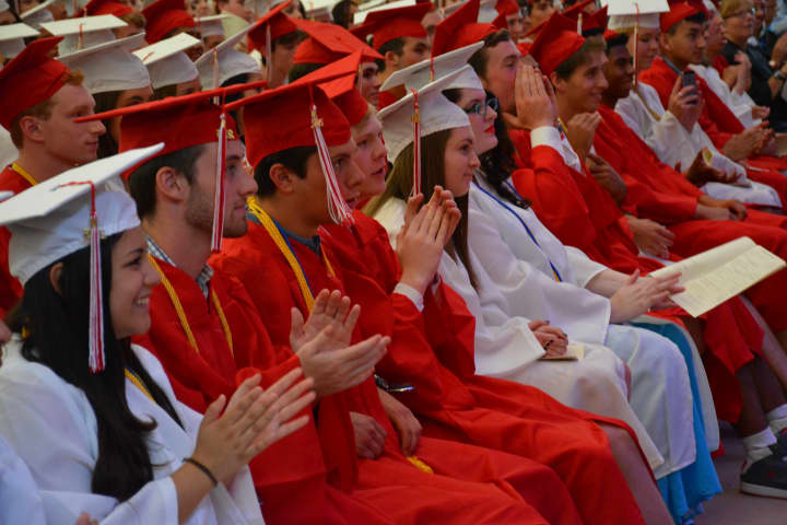 Members of Fox Lane High School&#x27;s class of 2015 give their applause at commencement.