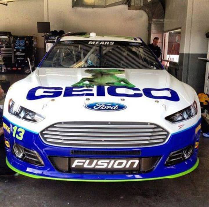 The GEICO NASCAR show car is a full-scale replica of the car raced by NASCAR driver Casey Mears.