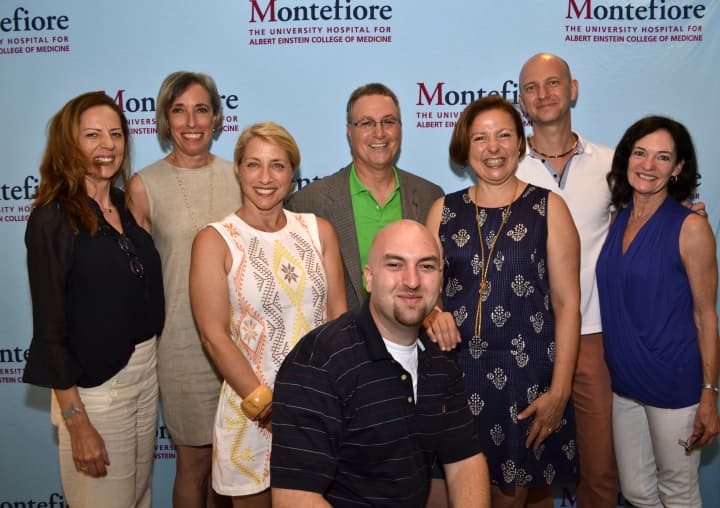 Homeowners and event organizers pose during the 15th annual New Rochelle Home Tours, held to benefit Montefiore New Rochelle.