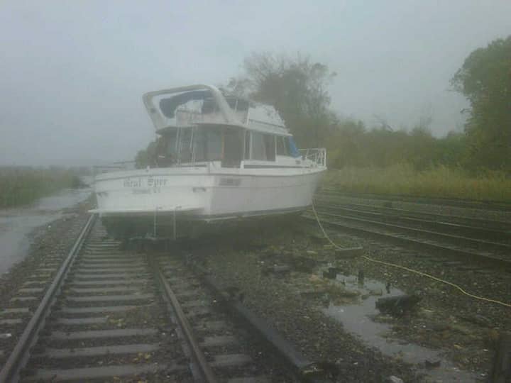 A boat washed up onto train tracks in Ossining Tuesday morning due to Hurricane Sandy. 