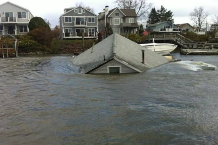 A Fairfield Beach Road home is submerged by flooding after Hurricane Sandy.