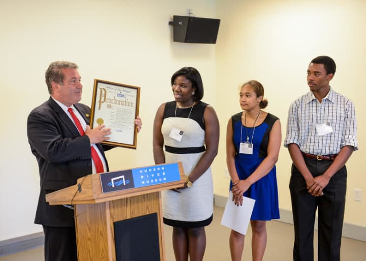 Yonkers Mayor Mike Spano presenting Proclamation, with (from left) Aisha Yusuf, program coordinator and interim manager of Youth &amp; Family Programs; and Junior Docents Toni Jackson and Emanual Phillip.