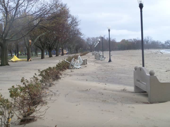 Sand, debris and toppled benches at Calf Pasture Beach in Norwalk Tuesday following Hurricane Sandy. City officials closed the beach, and Cranbury and Veterans Memorial parks, until further notice due to unsafe conditions.