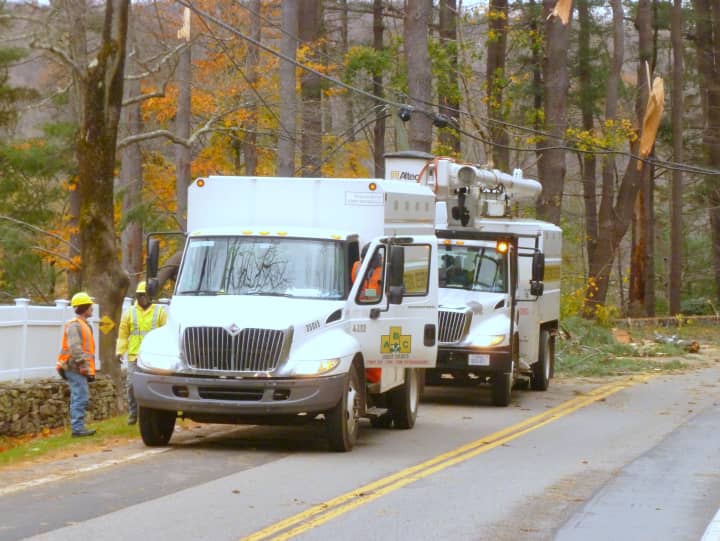 A tree service company works to clear Route 137 (Stone Hill Road) in Pound Ridge on Wednesday afternoon.