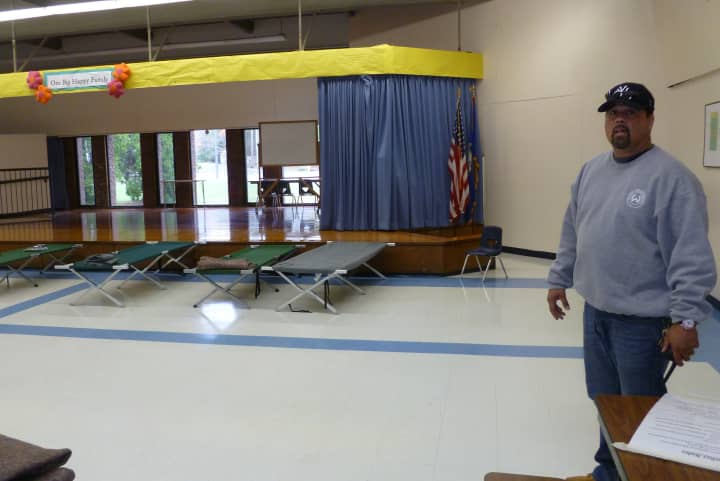 Willie DeHostos, head custodian at Miller-Driscoll School in Wilton, is also helping to run the town&#x27;s emergency shelter there. The shelter opened in the wake of Hurricane Sandy. 
