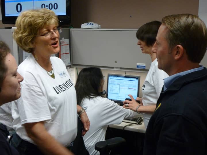 County Executive Robert Astorino talks to volunteers at United Way&#x27;s 2-1-1 center in White Plains Thursday.