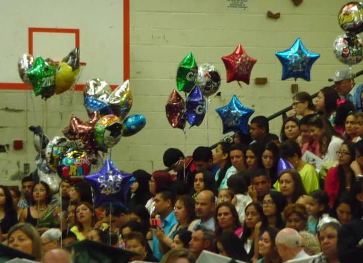Parents, friends and family members watch the graduation ceremonies at New Rochelle&#x27;s Isaac E. Young Middle School.
