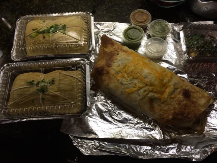 A dish of two tamales and a burrito, offered by the Rincón Taqueria in Norwalk.