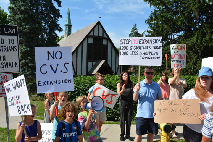 Demonstrators at a recent protest against a proposed expansion of the Katonah CVS.