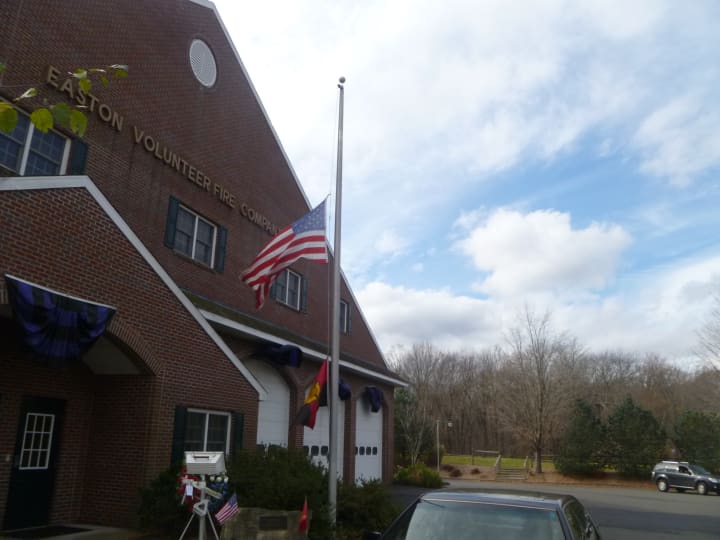 Flags flew at half mast at the Easton Fire Department to memorialize Lt. Russell Neary, who was killed Monday night clearing downed trees and debris during Hurricane Sandy.