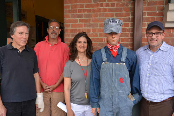 Left to right: Bedford Hills Historical Museum members Richard Carmichael,  Richard Satenberg, Ellen Cohen and David Zapsky pose with a lifelike mannequin dressed in vintage railroad attire.