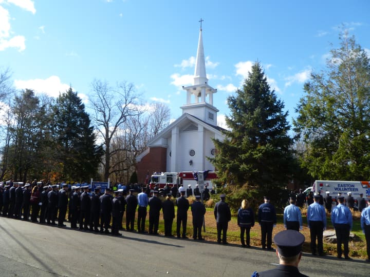 Fire personnel from Connecticut, neighboring states and Canada attended the memorial service for Easton firefighter Russell Neary at Notre Dame Church Saturday morning.