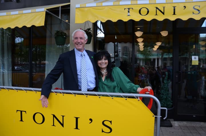 Toni Sapienza, chef and owner of Tonis Tuscan Table, celebrates the opening of her downtown location with Mayor Bill Finch. 