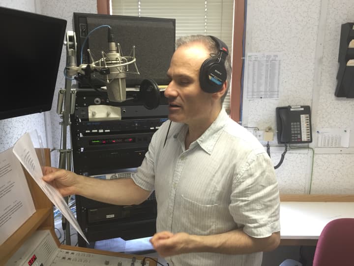 Mark Herz, senior editor and host for WSHU, goes to work in the studio Thursday.