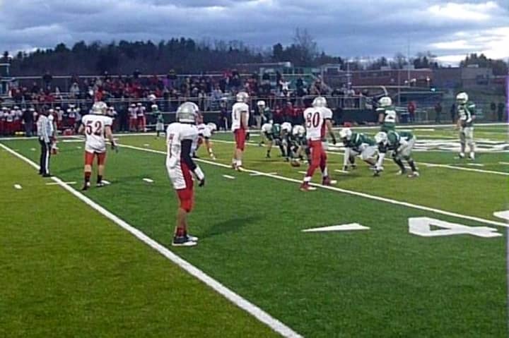 The Sleepy Hollow football team (in white) lines up for the final play in its sectional semifinal win against Brewster.