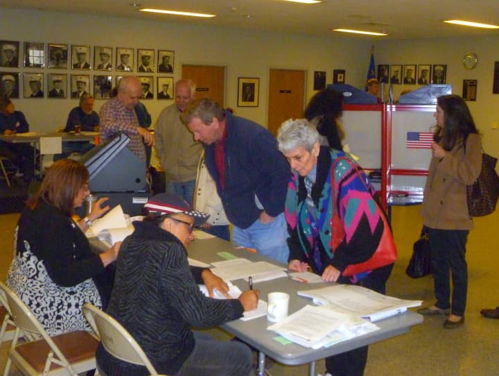 Voters keep election inspectors busy Tuesday morning at the South Salem firehouse polling location.