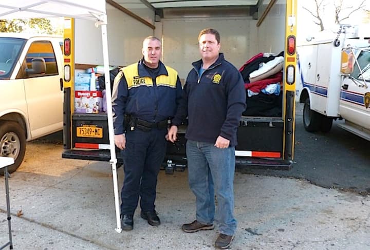 From left, Officer Peter Dandreano and PBA President Sean Hagan will collect donations for Hurricane Sandy victims at the Greenburgh Police Department this week.