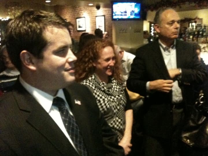 From left, Democrats Andres Bermudez-Hallstrom, Ilissa Miller and Leon Potok celebrate Tuesday night.