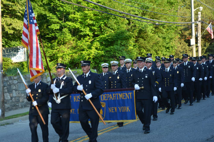 Members of the Mount Kisco Fire Department march in their 2014 parade.