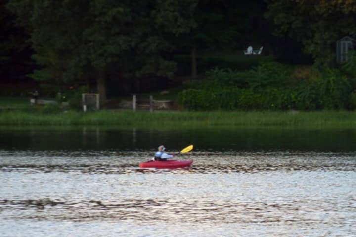 A kayaker enjoys the Saugatuck River.