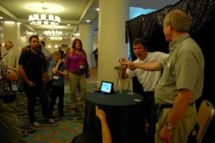 Redding resident Lee Winters, center, entertains last week in Philadelphia at the Society of American Magicians annual conference.