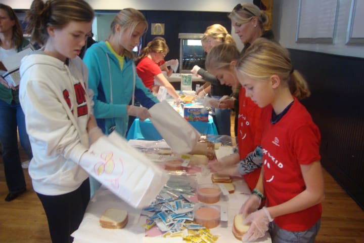Darien kids make sandwiches and put them into decorated bags for victims of Hurricane Sandy.