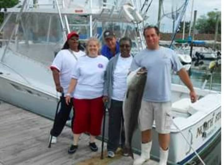 From left, Sharon Eleazer, first-place winner Katherine Swenson, Paul Chiepetta, Shannon Lyons, and captain Chris Broadbent at the Hooks For Heroes fishing tournament in Stamford.