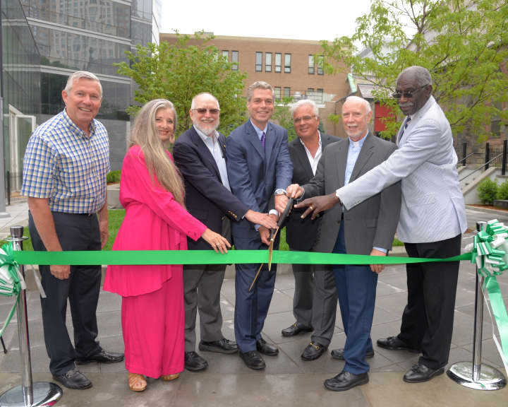 Dedicating a new park in downtown White Plains are, from left, Common Council members John Martin, Milagros Lecuona and John Kirkpatrick; Mayor Thomas Roach; Louis Cappelli, the Rev. Richard A. Kunz and Walter Simon, senior warden of Grace Church.