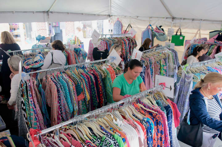 Shoppers stroll through a clothing display along the Post Road in Darien.