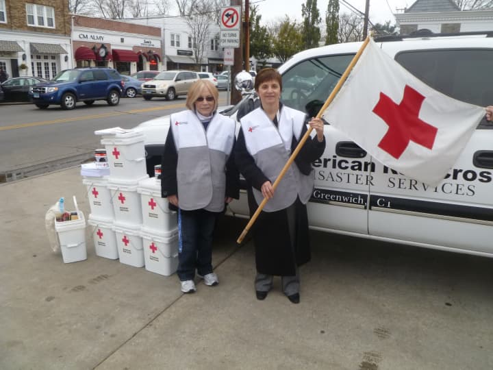 Greenwich Red Cross volunteers gave out clean-up kits Saturday at the Sound Beach Volunteer Fire Company.
