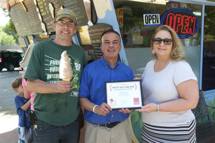 Daily Voice managing Editor Joe Lombardi (center) presents Brian and Deb Hopkins with the DVlicious Best Ice Cream in Westchester award.