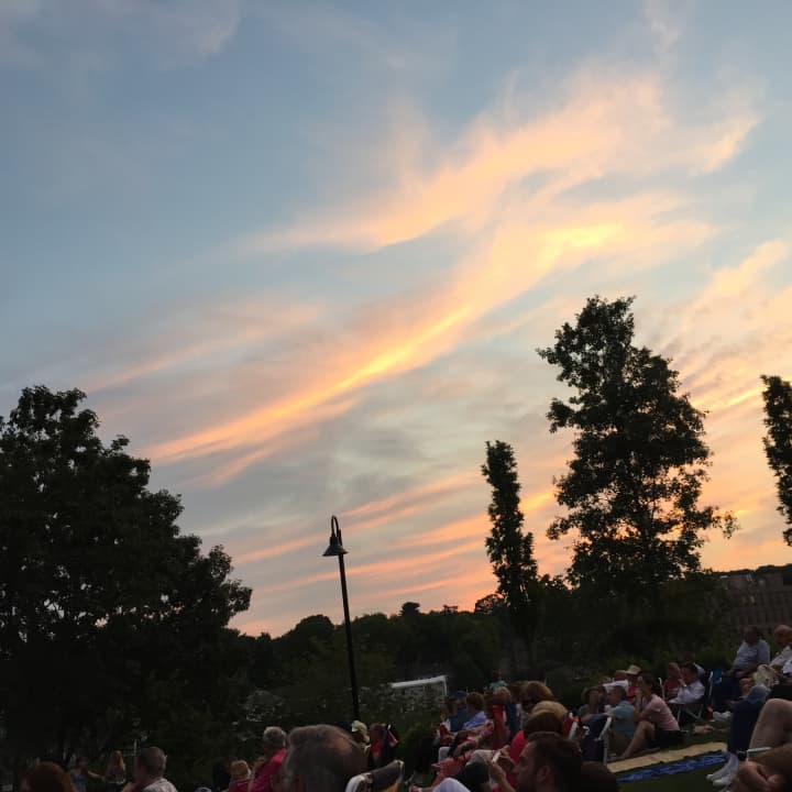 The sun goes down at Levitt Pavilion during a performance by The Barons.