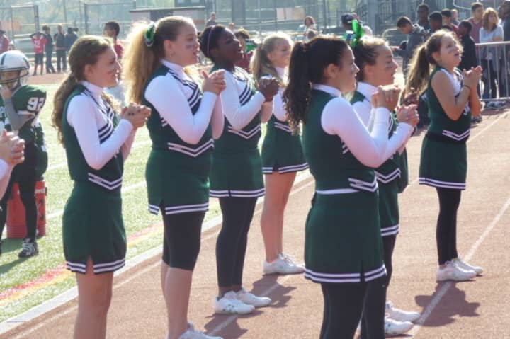 Cheerleaders from Rippowam Middle School perform at a football game on Sunday at Boyle Stadium.