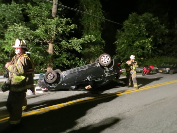Putnam Valley volunteer firefighters at the scene of a one-car crash on Oscawana Lake Road on Wednesday night.