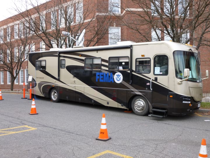 The Mobile Communications Office Vehicle for FEMA is parked outside Norwalk City Hall on Thursday. FEMA representatives meet with residents affected by Hurricane Sandy in a makeshift office inside City Hall. 