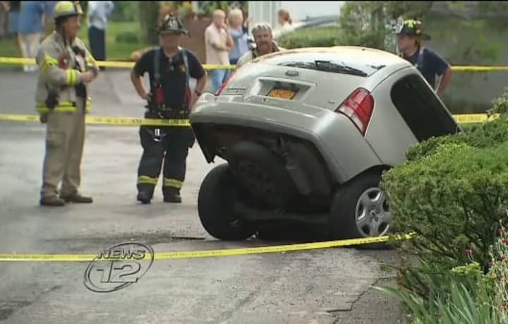 A woman&#x27;s minivan was swallowed by a sinkhole Tuesday in hastings. 