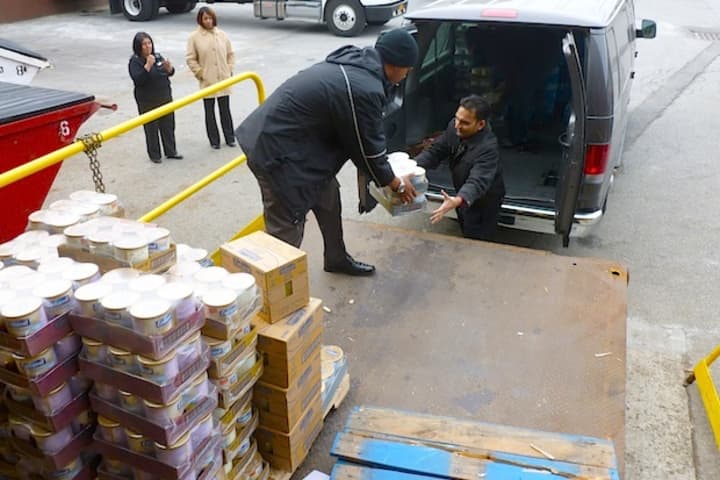 Members of the Church of God of Prophecy in Mount Vernon load donations from The Food Bank for Westchester into their van for the church&#x27;s Thanksgiving soup kitchen.