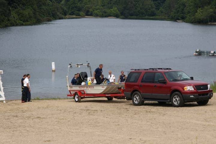 Emergency crews respond to a drowning at Lake Mohegan in 2012.