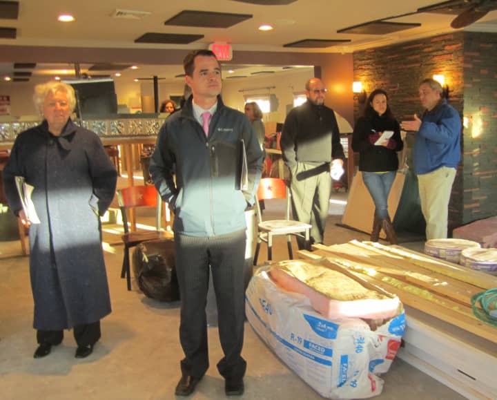 Assembly member Sandy Galef (D-Ossining) and state Sen. David Carlucci (D-Rockland/Orange) survey damage Friday at Ossining&#x27;s Boat House Restaurant. 