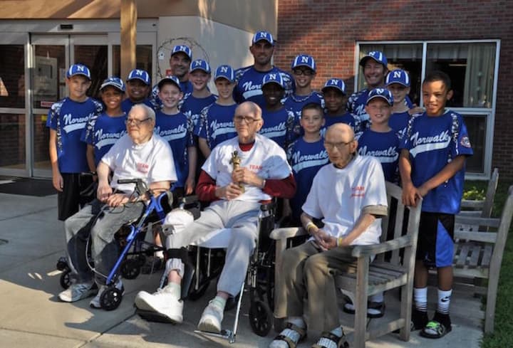 Seniors from Autumn Lake Senior Center visited with players from the Norwalk Cal Ripken 11-year-old All-Stars prior to the state tournament.