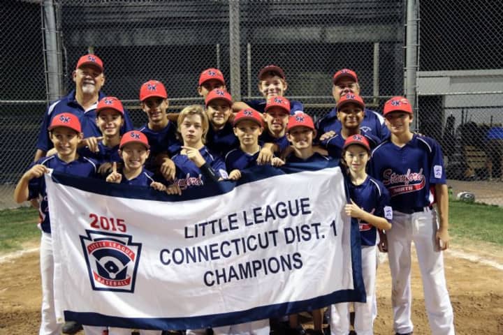 Stamford North Little League players and coaches celebrate after beating Weston for the District 1 title.