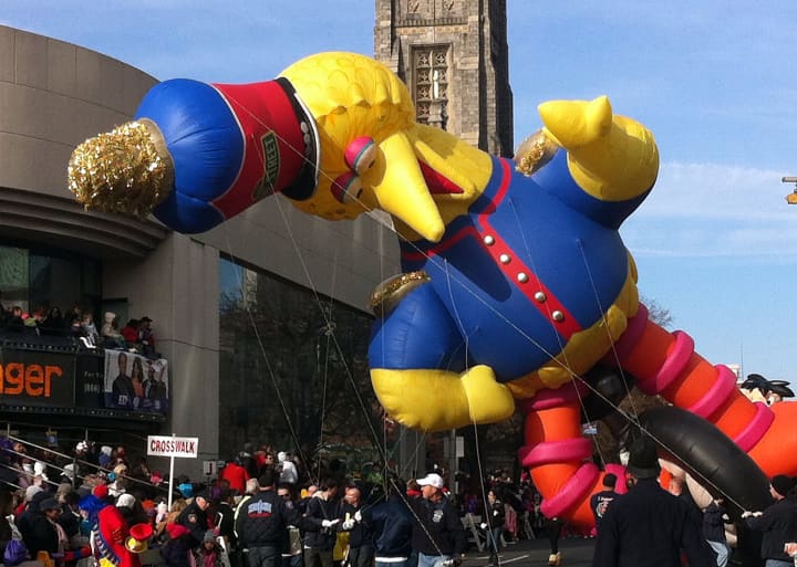 Big Bird leans down over thrilled crowds at the UBS Parade Spectacular in Stamford Sunday afternoon.
