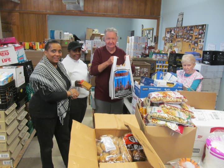 Volunteers for HOPE Community Services in New Rochelle work on Sunday to prepare for the Thanksgiving holiday in the organization&#x27;s food pantry.