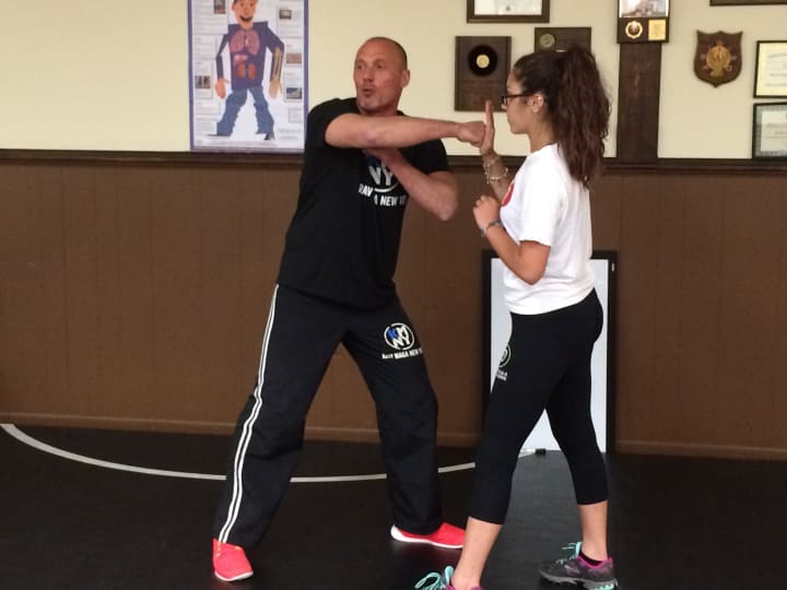 Davide Gristina of Krav Maga New York and daughter Noemi demonstrate in a July 20 free lesson how to defend against physical bullying.