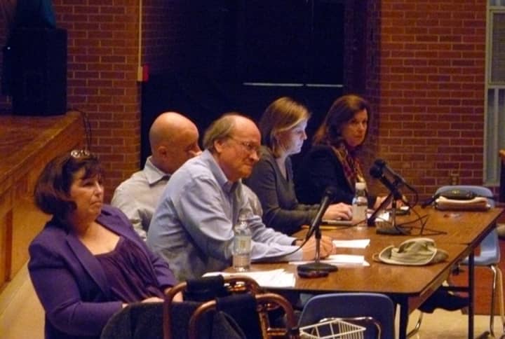 Members of the Facilities Reconfiguration Committee listen to Ridgefield parents and residents concerns Monday night at a public hearing regarding a school closure.