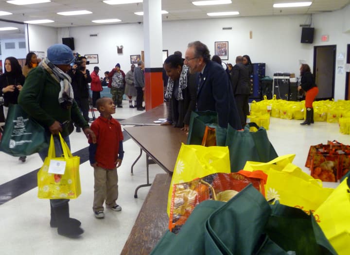 City Councilman Michael Sabatino hands out turkeys Tuesday at the Nepperhan Community Center in Yonkers. 