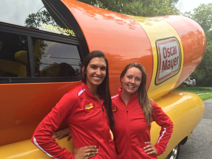 Angela Bumstead, left, and Alissa Endres in front of the Wienermobile.