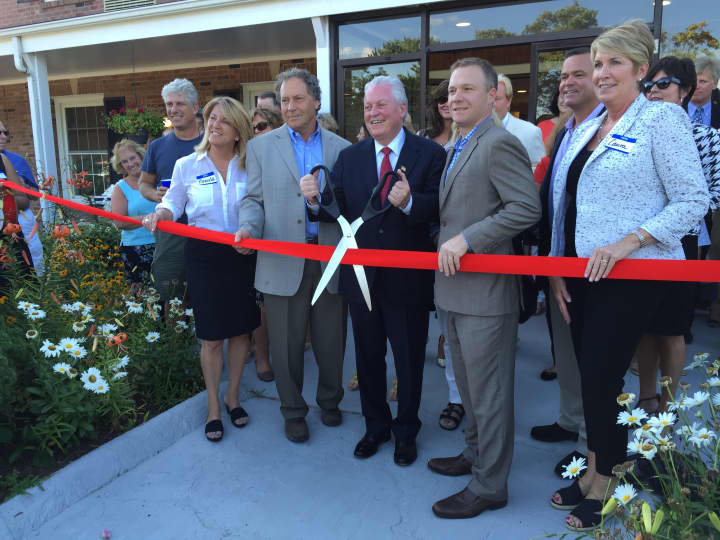 First Selectman Michael Tetreau along with local leaders and hotel owners cut the ribbon on the new Fairfield Circle Inn on Thursday eveing.